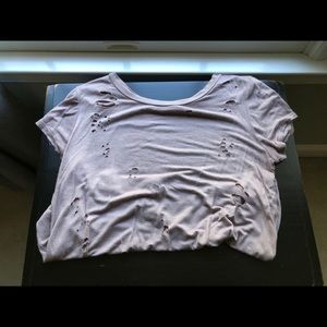 Blush shirt with holes in it